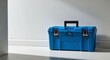 © Arceli - Bright blue tool chest resting on a clean white surface