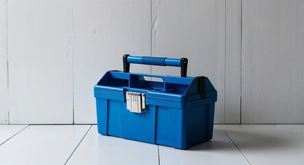 Wall Mural - Vibrant blue toolbox placed against a stark white backdrop