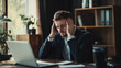 © SMPTY - Frustrated businessman struggling with work at his desk in modern office, looking stressed while staring at laptop screen, concept of workplace stress and corporate burnout