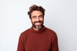 © Markus Schröder - Portrait of a cheerful man in his 30s dressed in a warm wool sweater on white background