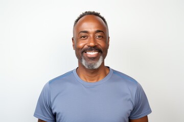 Sticker - Portrait of a tender afro-american man in his 40s wearing a moisture-wicking running shirt on white background