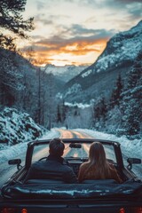 Wall Mural - A man and woman are sitting in a convertible car with a view of the sunset on the mountain