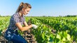 © dongwei - Female Farmer in Checkered Shirt Working in Vineyard