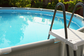 Canvas Print - Above ground swimming pool outdoors on sunny day, closeup