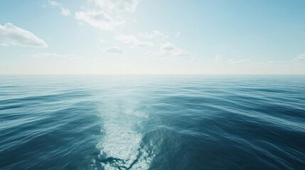 An aerial view of the open ocean, showing calm blue waters with subtle wave patterns, suitable for a peaceful background. , background