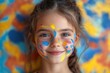 © Vesna - a joyful girl her face vibrantly painted with colorful designs beams with happiness the background is lively filled with bright colors capturing the essence of childhood delight and creativity