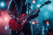 © Fotograf - A musician strums his guitar while wearing a bold leather jacket, perfect for use in music-themed visuals or promotional materials
