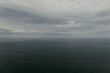 © Avalepsap - Raining sky over the Atlantic Ocean, Tenerife. Minimalism. Misty morning in the sea. Calm view. Tranquil empty landscape with soft blue gray sky. Natural gloomy weather.