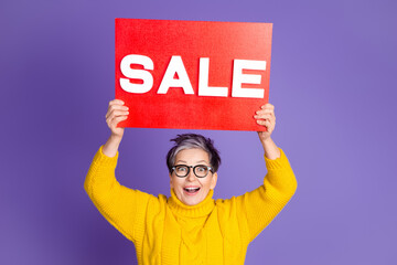 Wall Mural - Photo of charming positive woman wear yellow sweater rising sale card empty space isolated violet color background