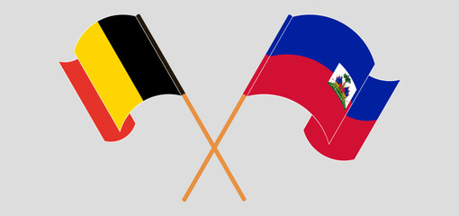 Crossed and waving flags of Belgium and Republic of Haiti. Vector illustration