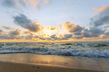 Seascape at sunset. Bright sundown on the sea shore. Sunset on the Baltic Sea.