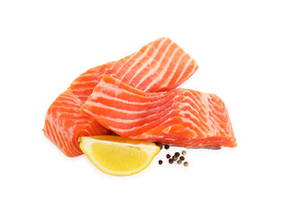 Wall Mural - Pieces of fresh salmon, lemon and peppercorns isolated on white, above view