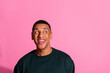 © deagreez - Photo of funky cool guy dressed pullover smiling looking emtpy space isolated pink color background