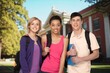 © BillionPhotos.com - Group of happy student friends in college campus
