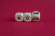 © Liudmila - No fear and excuses symbol. Concept words No fear No excuses on wooden cubes. Beautiful red background. Business motivational no fear and excuses concept.