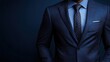 © Рудой Максим - A well-dressed man in a navy suit with a polka dot tie stands confidently against a dark background, showcasing style and elegance