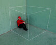 © ADDICTIVE STOCK - Man in red sitting inside an imaginary white box