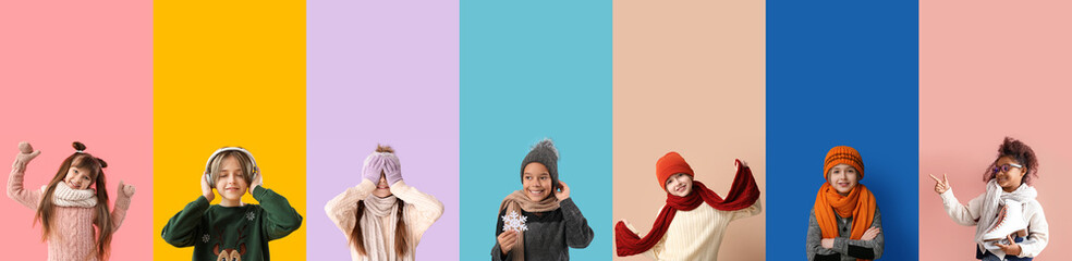 Wall Mural - Group of cute little children in warm winter clothes on color background