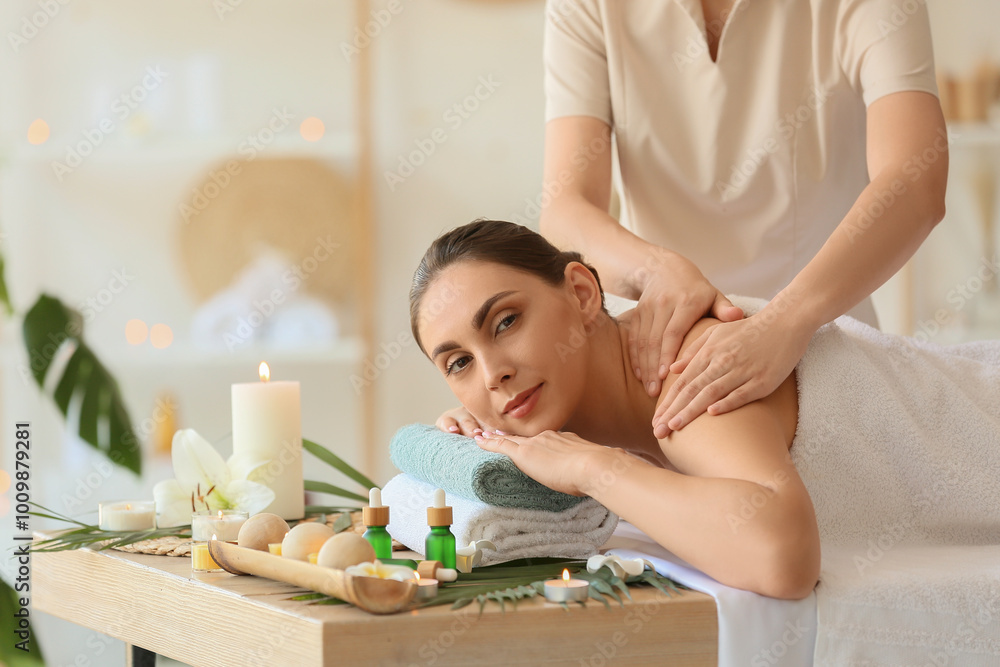 Young woman getting massage in spa salon