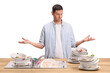 © Ljupco Smokovski - Angry man with a pile of dirty dishes in a kitchen sink on a wooden counter