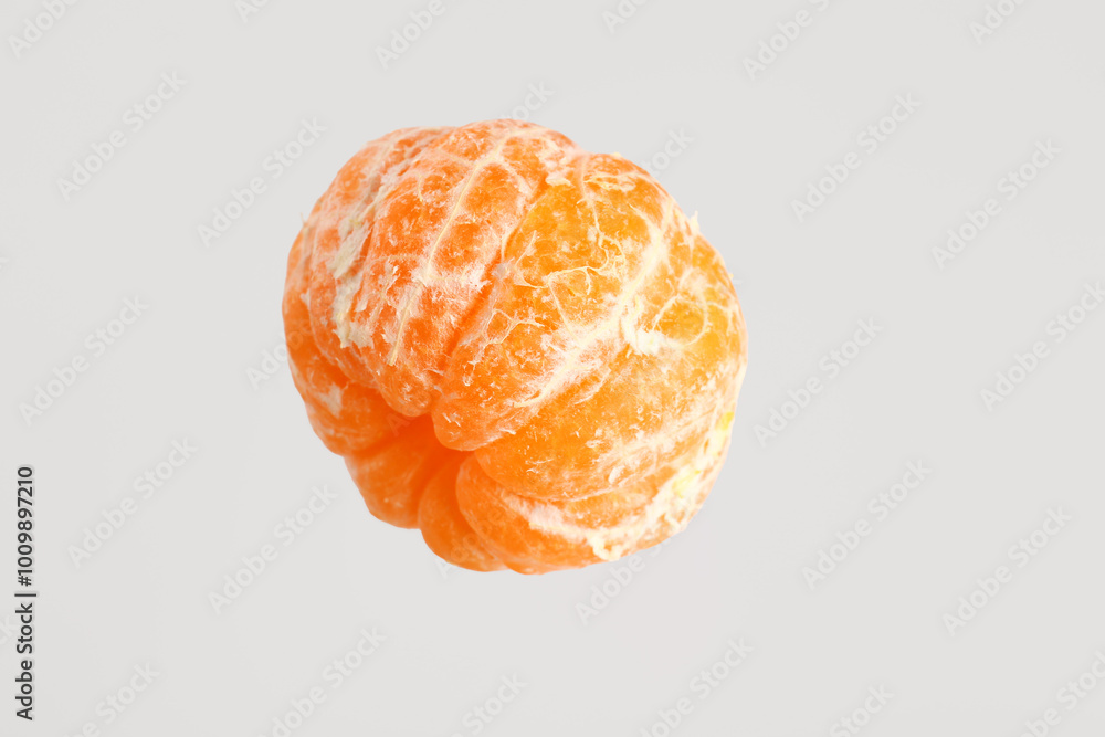 Flying fresh tangerine on white background