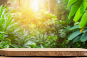 Wooden tabletop with blurred natural foliage background, sun shining through.