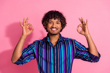 Canvas Print - Portrait of nice young man show okey symbol wear shirt isolated on pink color background