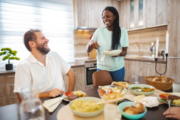 Enjoying a joyful meal together in a modern kitchen space