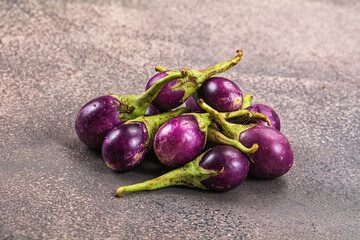 Small organic young purple round eggplant