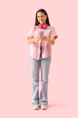 Poster - Young woman with chia seed water on pink background