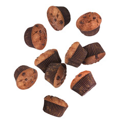 Poster - Delicious chocolate muffins in air on white background