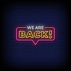 Wall Mural - we are back neon sign vector with brick wall background