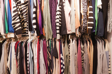 A Colorful Wardrobe that is Full of Various Clothing Items Neatly Organized on Hangers