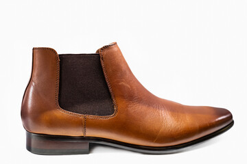 men's brown leather chelsea boots isolated on white background. boots made of genuine leather in cla