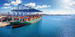 © moofushi - Panorama of a large container cargo ship beeing loaded and unloaded by large cranes in a commercial dock with copy space