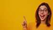 © Humans - White female with pointing finger. Simple background. Copy space image perfect for product sales, video thumbnails, discount sales promotion, etc. Smiling or surprised or angry expression.
