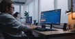 © Framestock - Man types prompt in AI video generator on computer. Artificial intelligence chatbot app generate detailed high-quality video of Jupiter and its moon. Female colleague works on PC in the background.