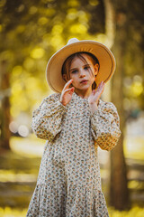 Wall Mural - portrait of a girl in autumn forest park 