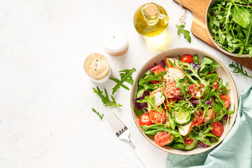 Healthy food, Dash diet, keto diet. Green salad with grilled chicken breast, Top view on white background.