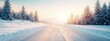 © CHA - A tranquil winter scene featuring a snowy road surrounded by frosted trees at sunrise, exuding calmness and the beauty of nature in the cold season.