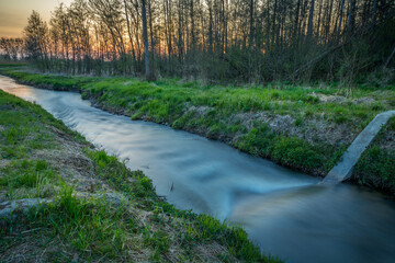 Evening view of the small Uherka river, Stankow, Poland