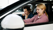 © wedmoments.stock - A happy young couple buys a family car in a modern dealership, excited about their new purchase. Their joy reflects the anticipation of new adventures and the importance of choosing the right vehicle.