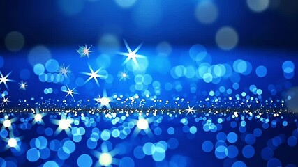 Soft bokeh with sparkling twinkling and shimmering lights on a vibrant blue motion background