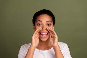 Photo of nice young woman speak whisper wear white t-shirt isolated on khaki color background