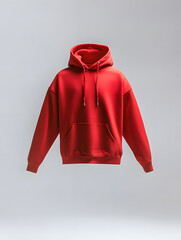 Wall Mural - A red hoodie sweatshirt floating in the air mock up, isolated on white background
