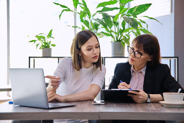 Wall Mural - Young female patient at therapy meeting with psychologist, mental therapist