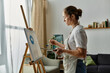 © Bliss - A woman with vitiligo passionately creates art in her cozy studio.