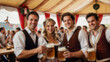 © Natasa - Blur image of a group of friends in traditional Bavarian attire raising beer steins in a toast at a festive indoor event in an Oktoberfest for background usage.