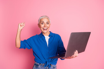 Poster - Photo of attractive lucky lady dressed blue shirt enjoy online shopping modern gadget empty space isolated pink color background