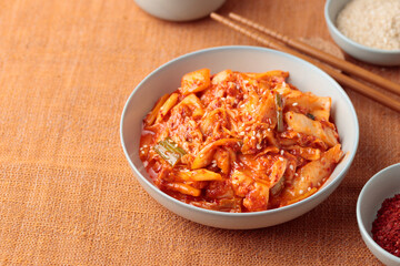 Kimchi, Kimchee in the Bowl, Red Spicy Kim Chi, Hot Fermented Napa Cabbage, Traditional Jimchi on a table